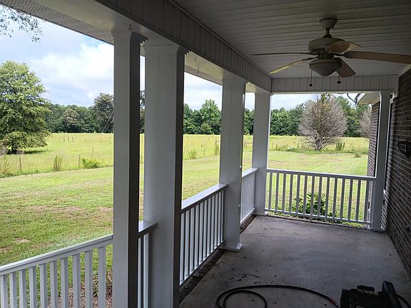 Front porch looking out. Yard extends to fence lines