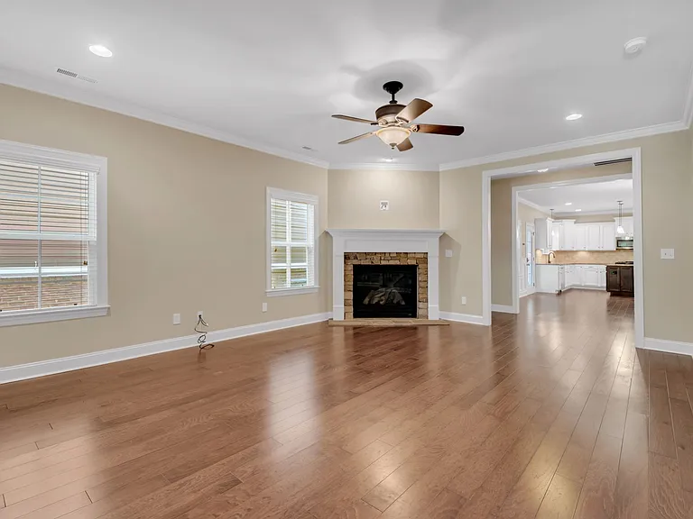Living includes a fireplace and opens to dining room