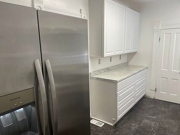 ice and water in door of large stainless steel refrigerator