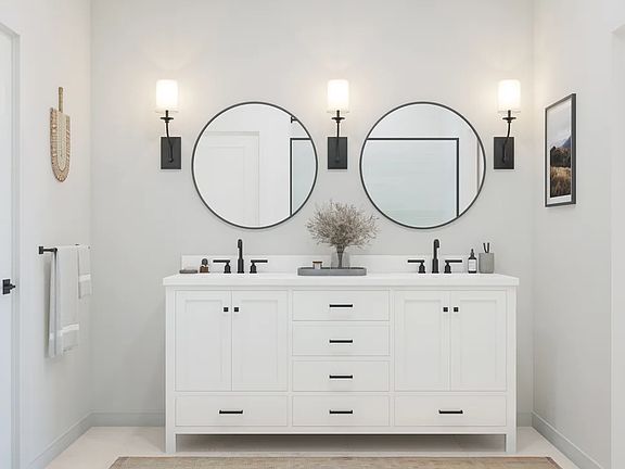 Primary freestanding vanity and black-circular mirrors