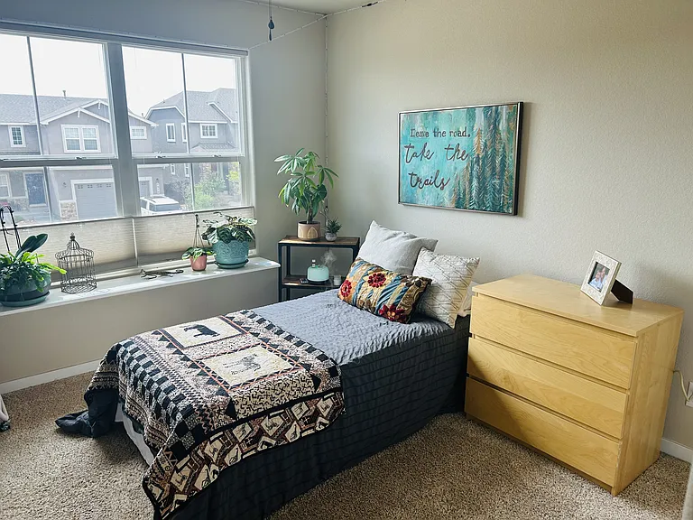 Third bedroom on the upper level with huge windows.