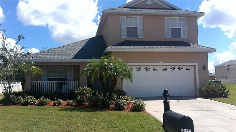 Beautiful curb appeal welcomes you to the covered porch.