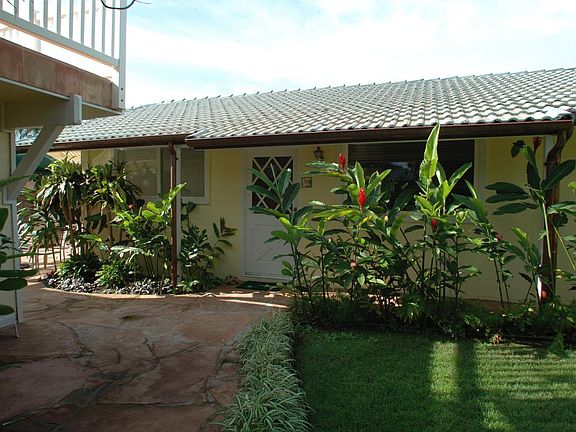 Cottage front door and grass area.