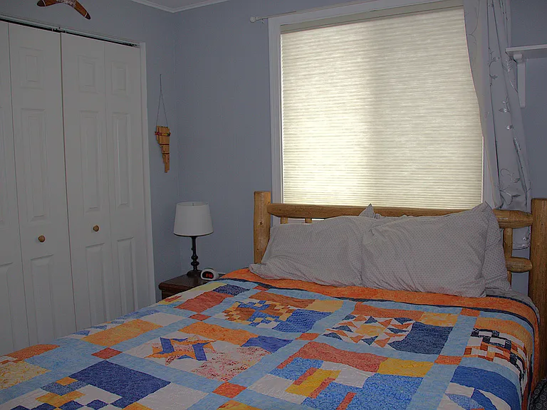 Second bedroom with large closet (furniture, wall art, curtains not included); custom top down bottom up blinds included