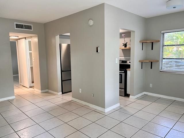 living area and dining area off kitchen