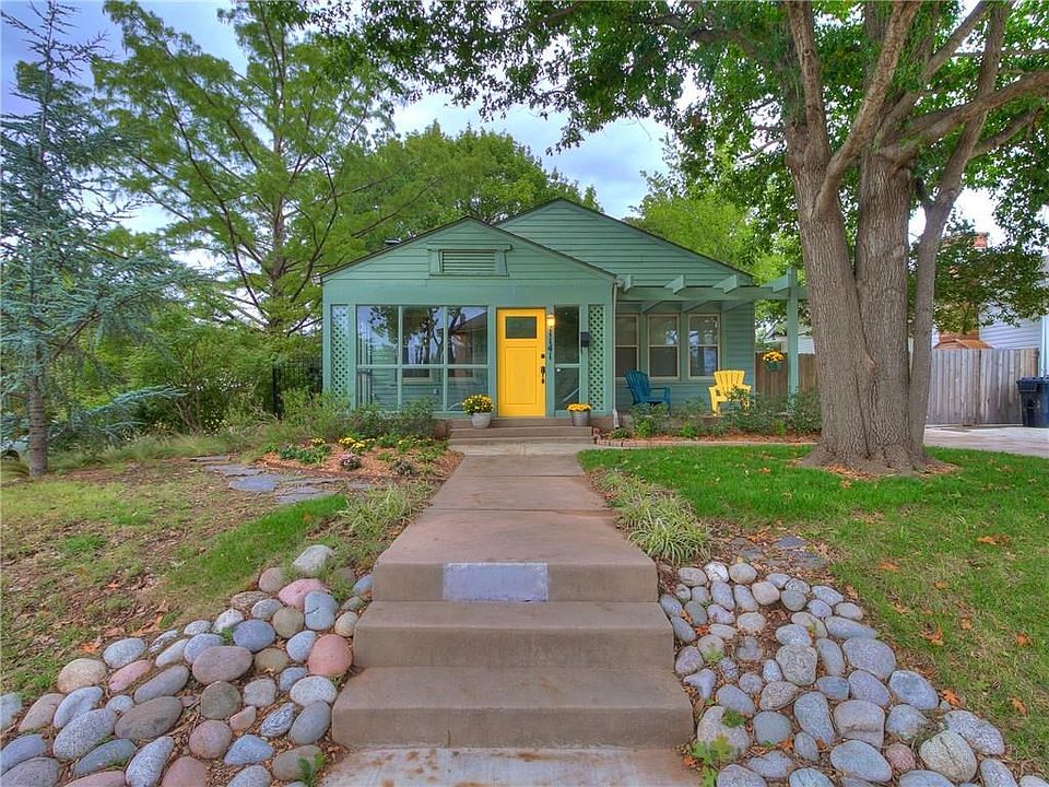 Charming home on corner lot with mature trees and landscaping. Glassed-in front porch and patio with pergola. New sidewalks and driveway.