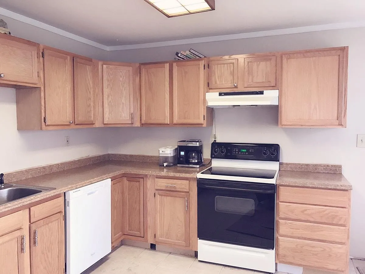 Kitchen with new laminate countertop, refinished cabinets - 411 Carrollton Dr