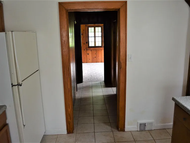 Hallway from Kitchen to a Bath and Sunroom