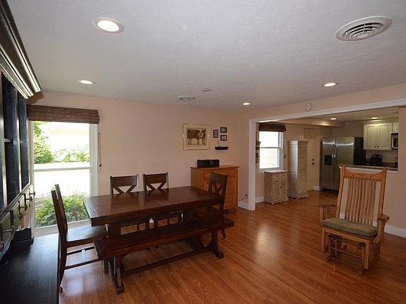 Cozy Family Room is right of the kitchen; current home owners use this area as both Dining Area and Family Room.
