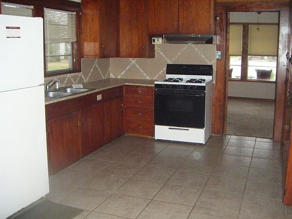 Kitchen showing stove and refrigerator