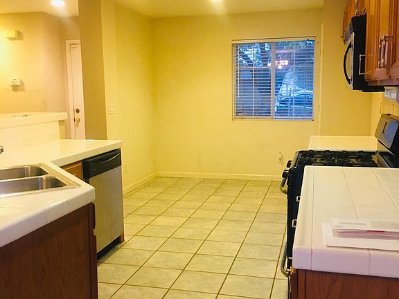 Nook and kitchen overlooking the living area