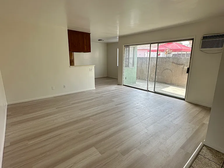 You have the living room and dining area new laminate flooring