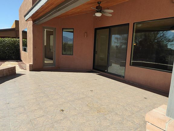 Tiled Patio In Private Back Yard Includes Misting System