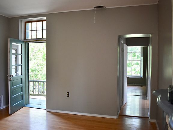 View from living room showing front door entrance and hallway