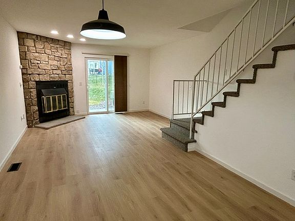 Living room with new plank flooring and carpet