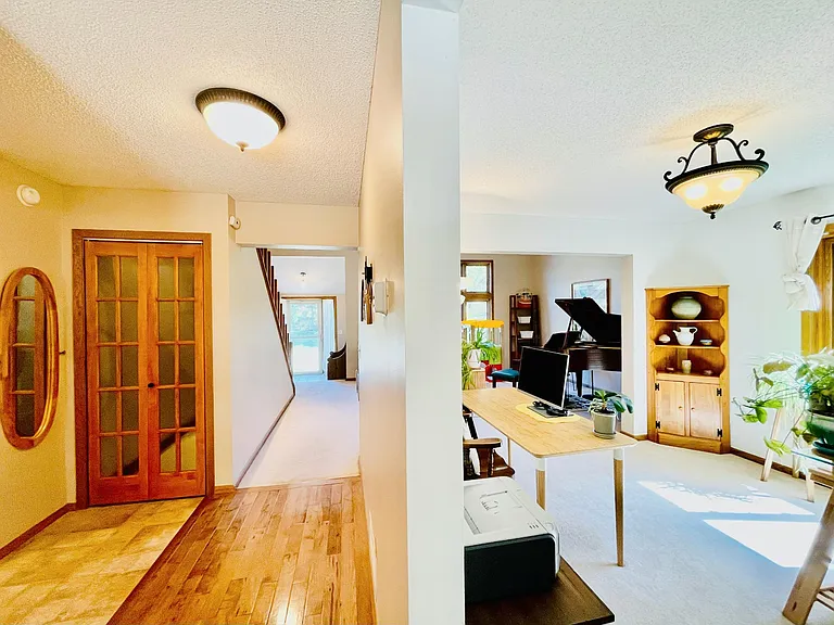 Hallway View. The glass door is entry for basement.