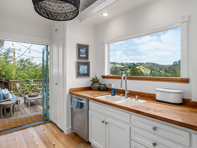 View of entrance to the kitchen from the front deck.