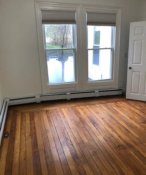 Bedroom with hardwood flooring, Bright & Sunny West Facing Windows.
