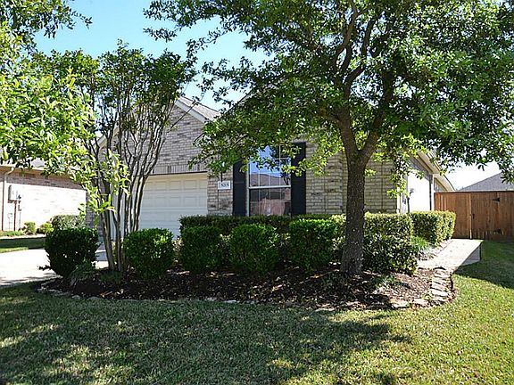 Front view of this enchanting home located at 5215 Sandyfields Ln.