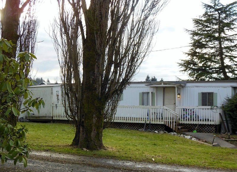 1969 mobile currently rents for $625/mo.. Sits at very front of property close to E. Smith Rd.