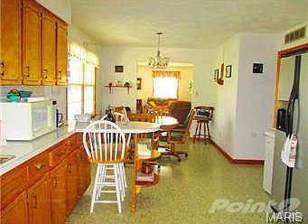Another view of dining room & living room from kitchen.