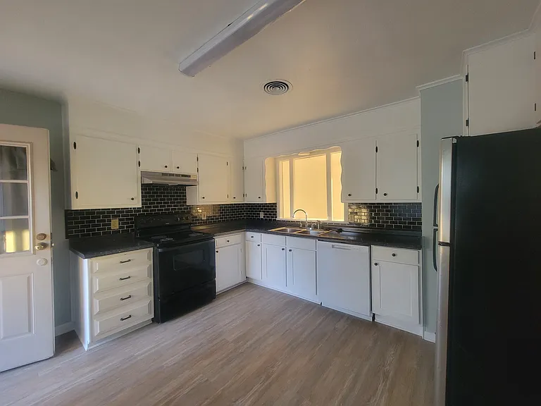 Kitchen with stove, new dishwasher, ref.