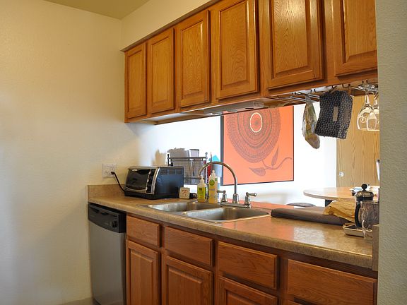 Kitchen with open bar to dining room