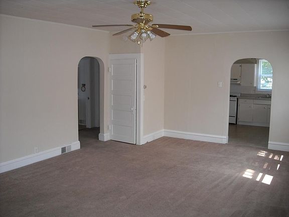Living room 23'3" x 15'2" door to right leads to kitchen, door to left leads to 2 bedrooms and bath