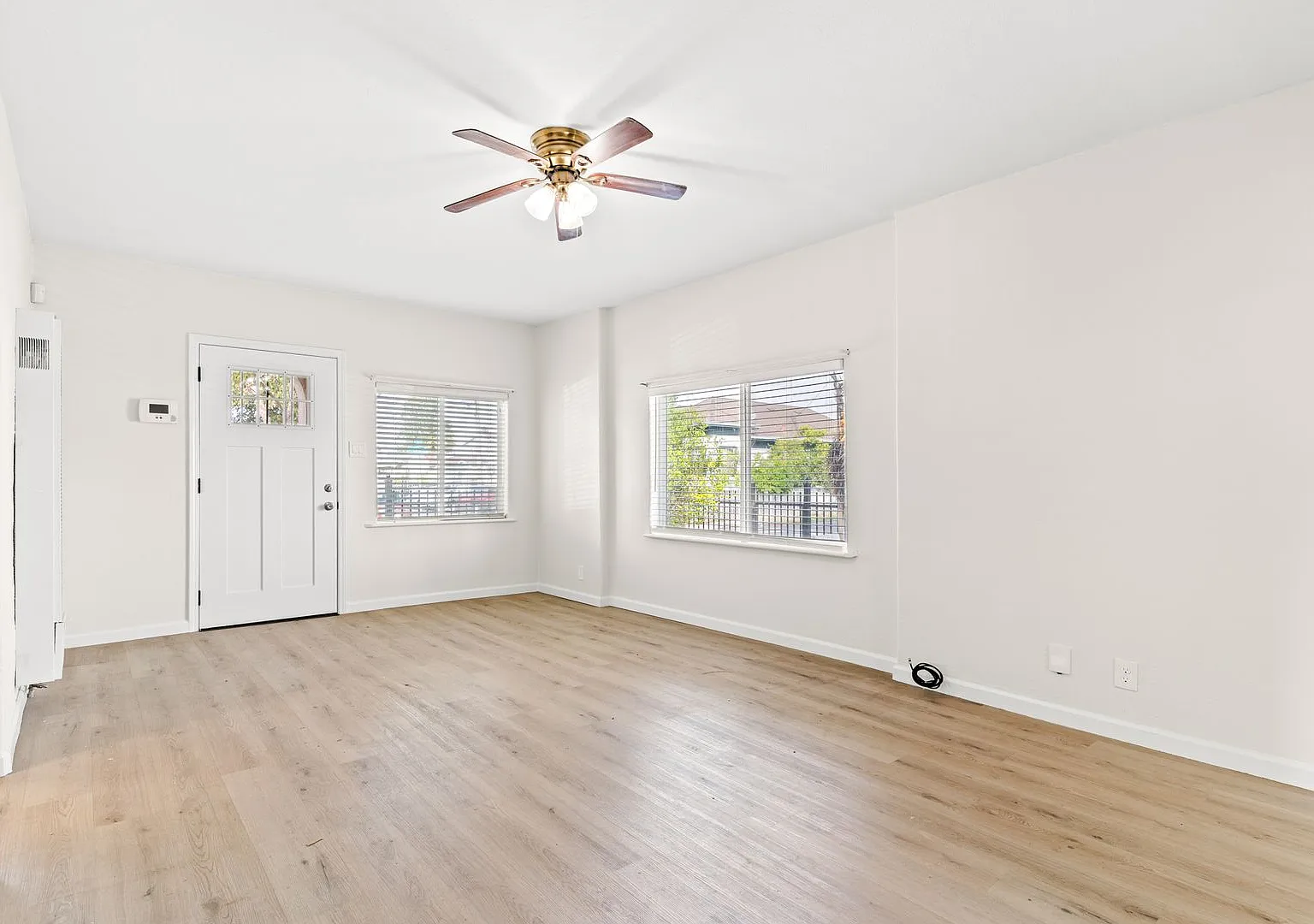 Bright & Updated 2-Bed, 1-Bath Corner-Lot Home | Gated Yard and Driveway — Photo 3