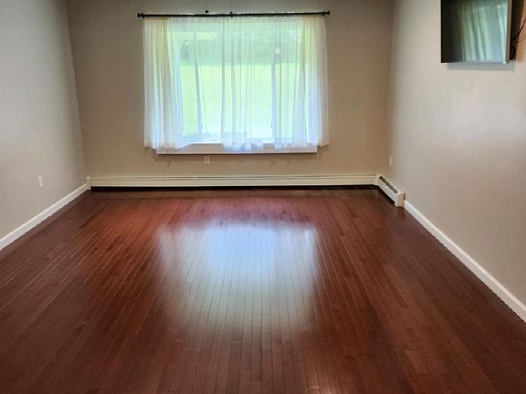 Large bedroom #1 with walk-in closet and attached full bathroom with shower.