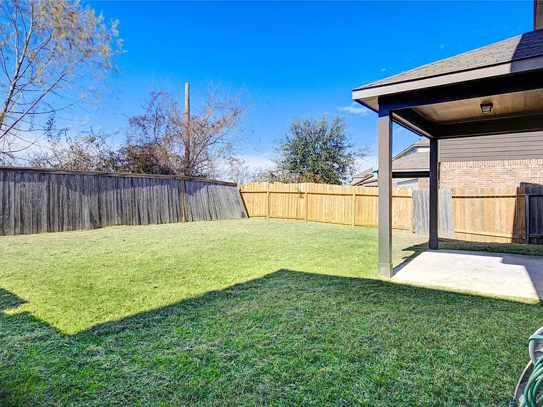 10907 Woodland Leaf Ln — Photo 31