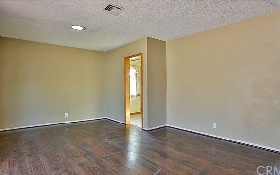 Living room has access to kitchen & dining area