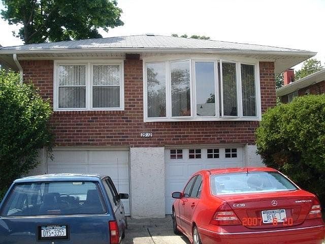 Grand entrance with direct street frontage and large open driveway and large deluxe indoor garage space