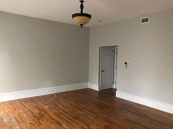 Main living space looking toward entry/coat closet.