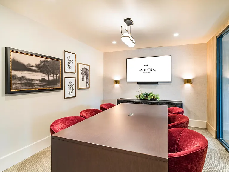 A polished conference room at Modera University Park, ideal for focused conversations and remote work in a refined setting.A private study room at Modera University Park, offering a quiet, design-forward setting for focused work and productivity.