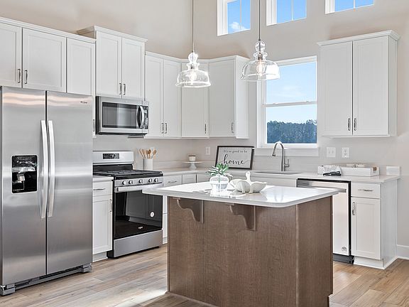 Sunlit Kitchen with Stainless Steel Appliances in the Aloha at Wetherby in Millsboro, DE