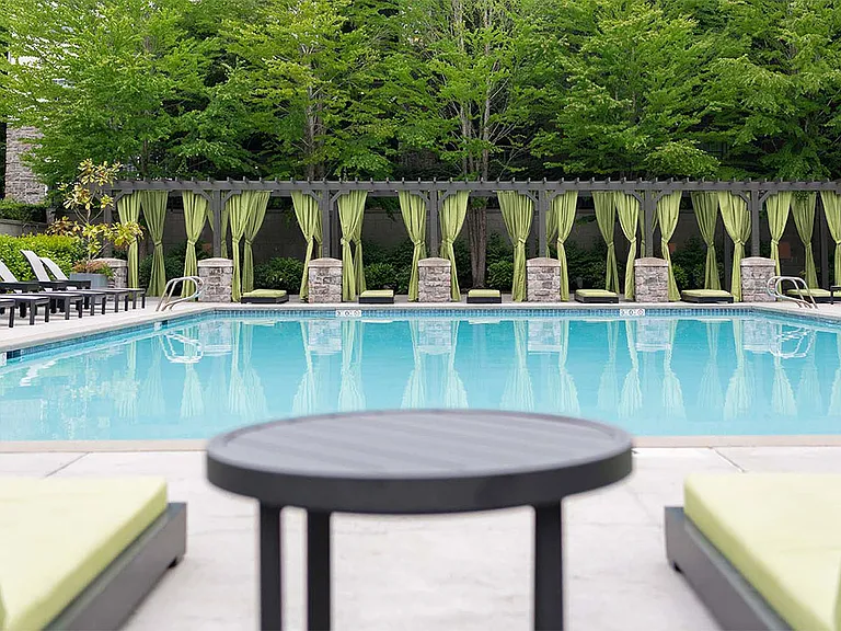 Apartment community resort style pool + cabanas at Griffis North Creek in Bothell, Washington.