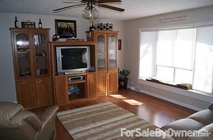 Upstairs Living Room
						:
						Wood Floor, Ceiling Fan & Bay Windows