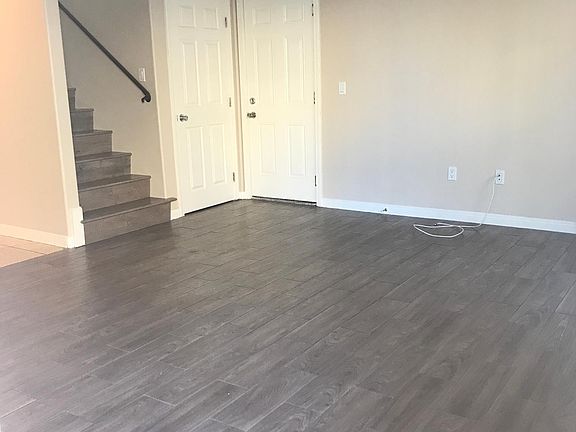 Living room viewing from front door. (Left door is storage closet and door on right is to garage.