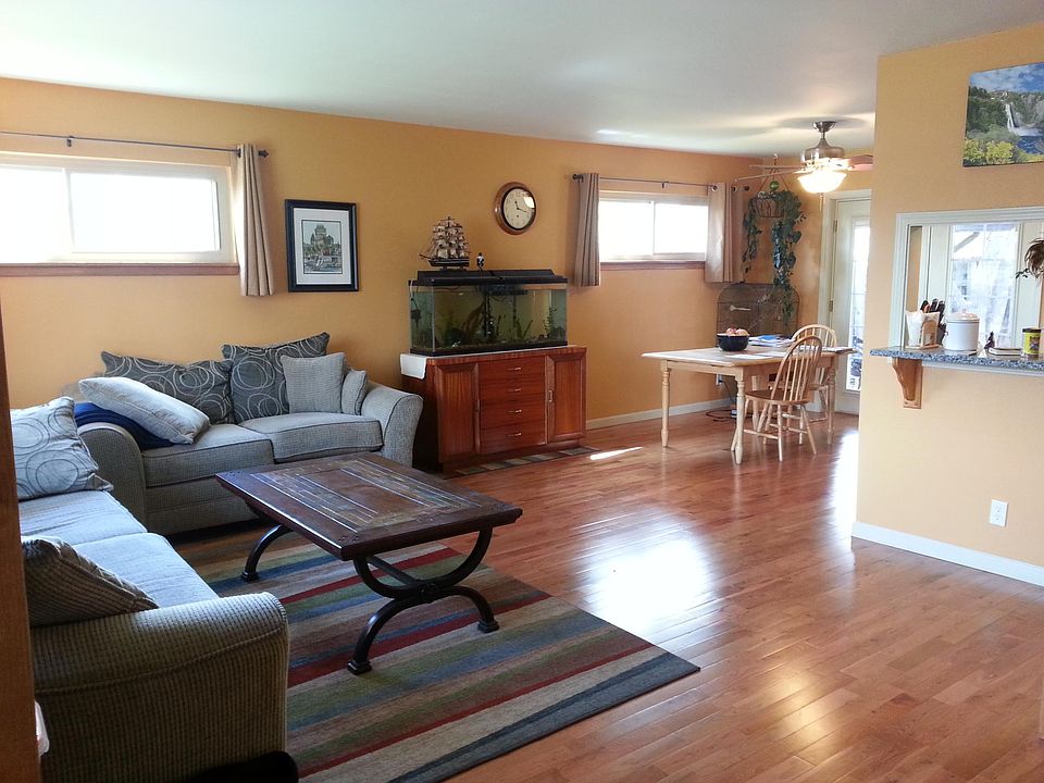 Open floor plan with hardwood floors