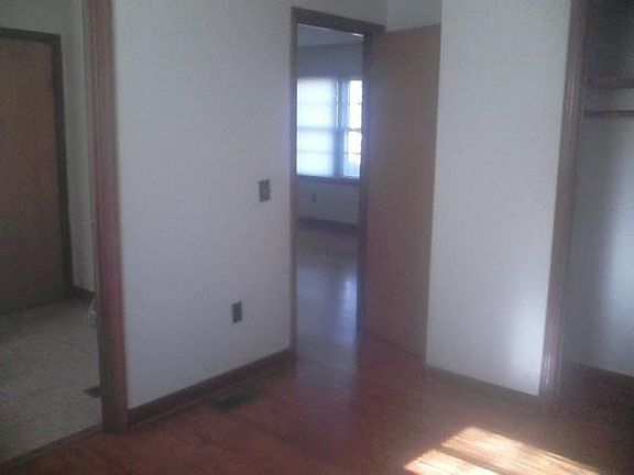 back bedroom with bathroom and living room access