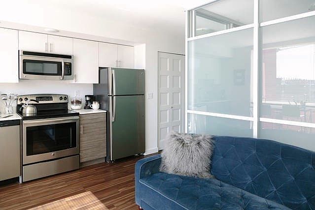 Living room and fully stocked kitchen with all the essential