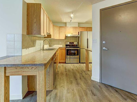 5th image of 402-186 Kananaskis Way #402