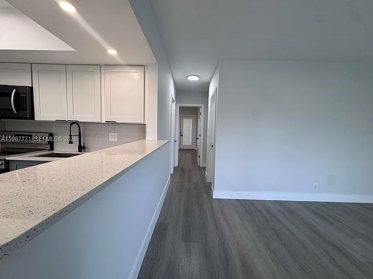 455 Golden Isles Dr #203 — Photo 7