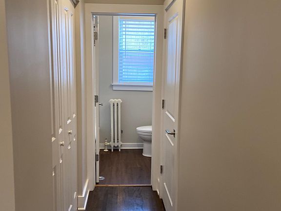 Hallway to bathroom and closet spaces.