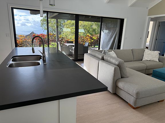 Fleetwood doors that slide into the walls for complete indoor/outdoor living to patio area off the living room/kitchen.