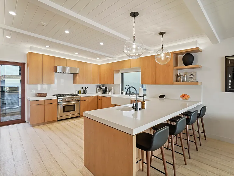 Prepare meals with ocean views and seamless indoor-outdoor flow.
Cook with confidence on a Wolf gas range, built for precision.