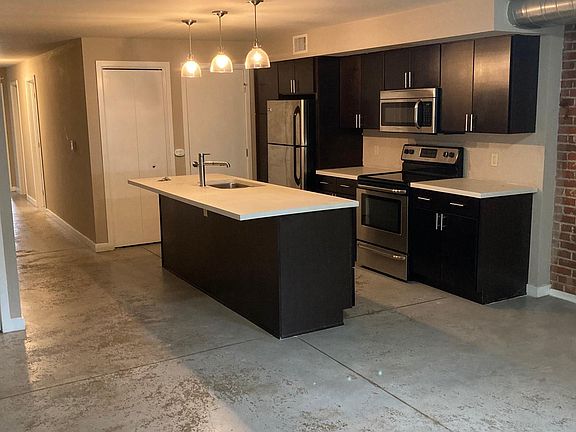 Large updated kitchen -- new LVP 'wood' floors installed (not pictured). Open concept living room next to kitchen