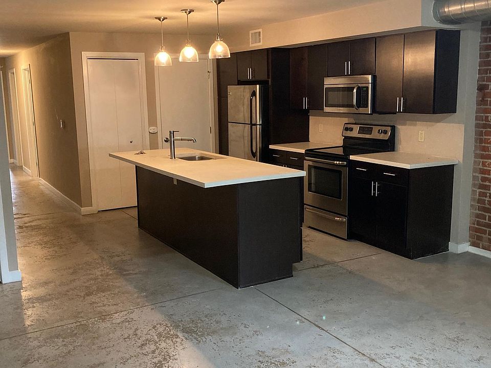 Large updated kitchen -- new LVP 'wood' floors installed (not pictured). Open concept living room next to kitchen