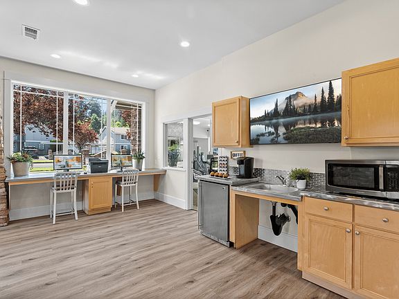 Clubhouse perks include a cozy coffee bar and business center.